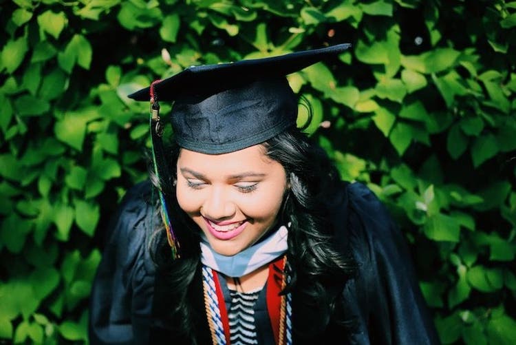 A smiling Master's in Electrical Engineering student on graduation day.